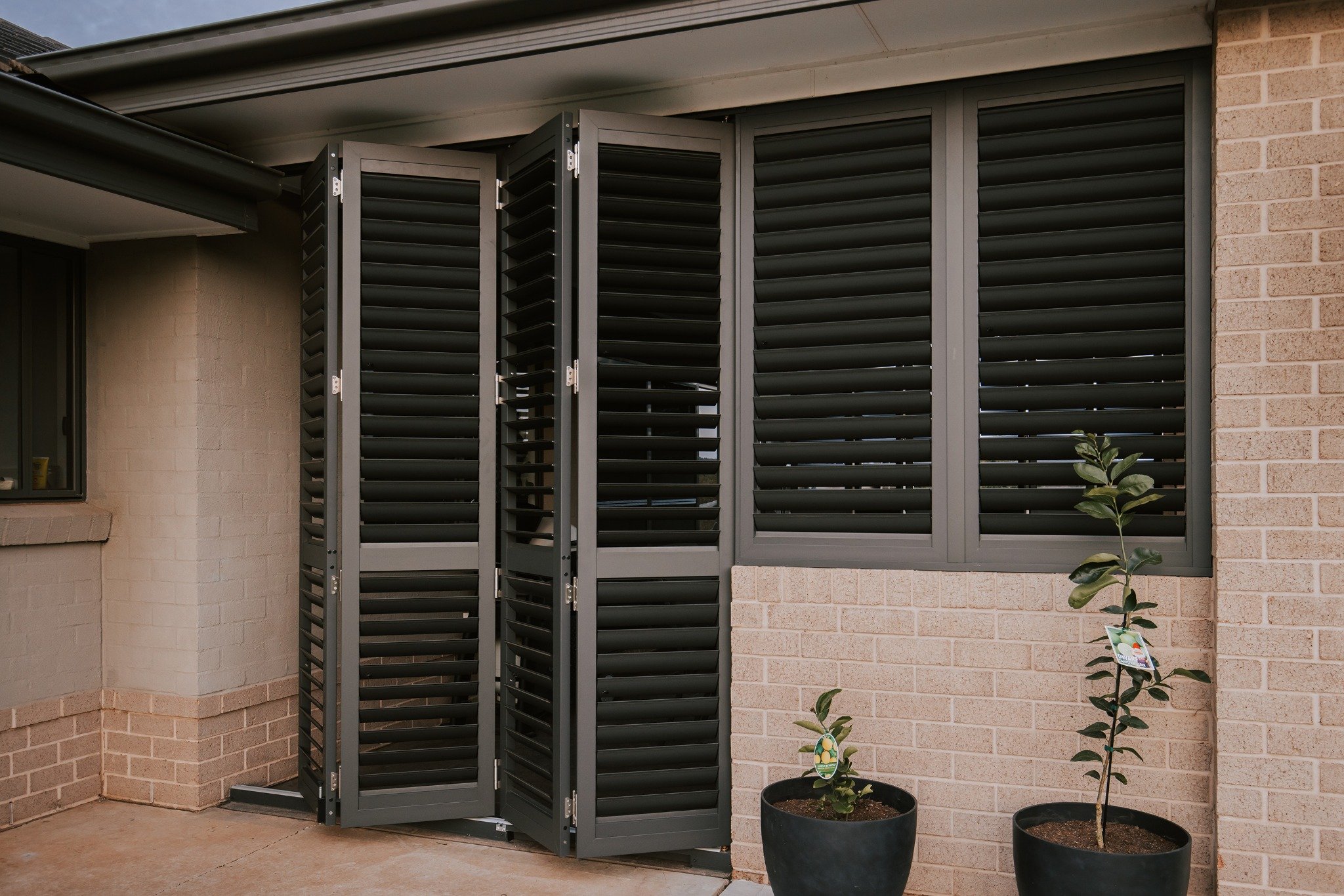 black aluminium outdoor shutters for sliding doors