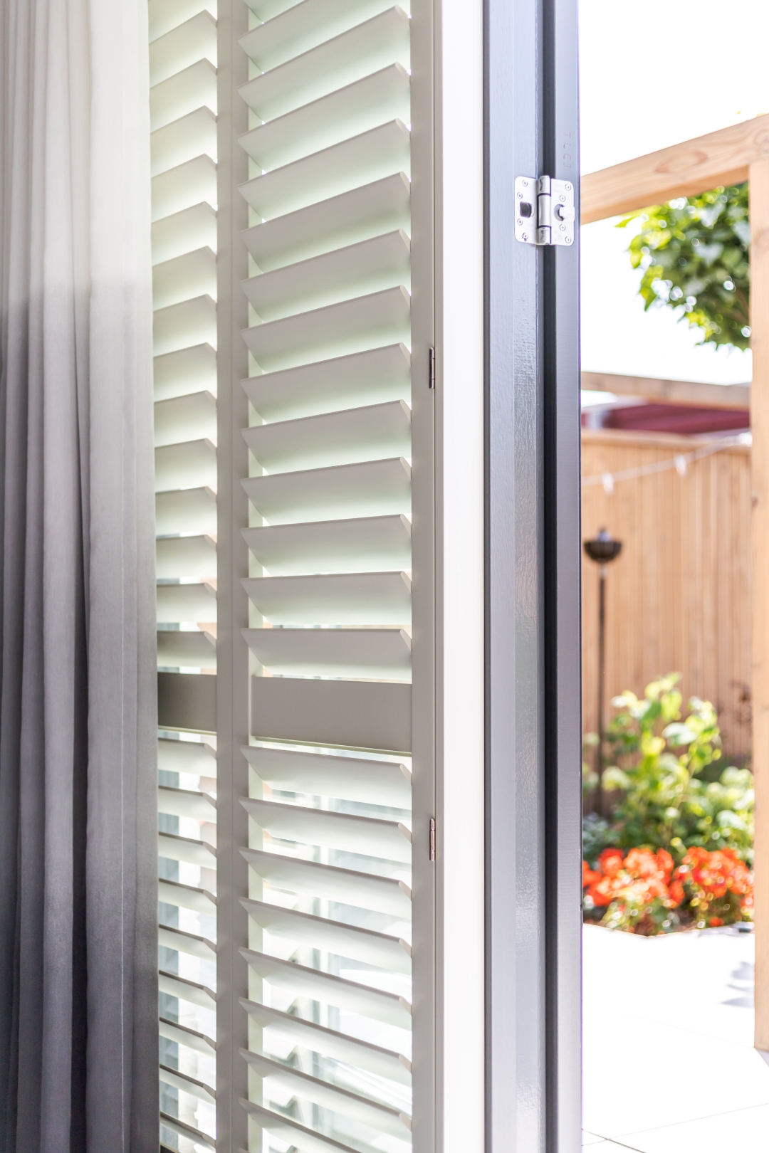 Window shutters with curtains